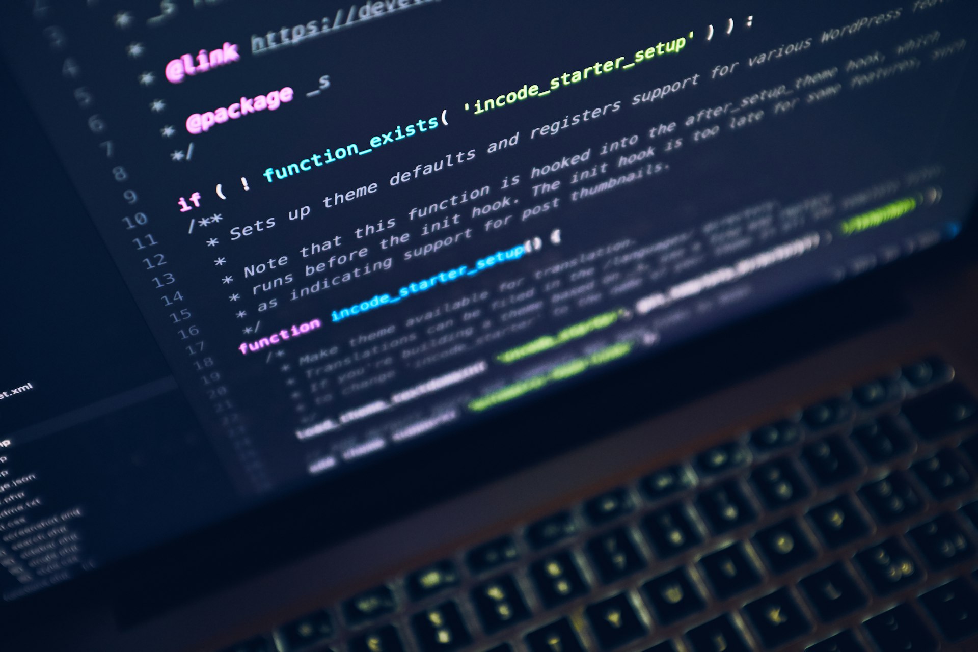 Laptop screen showing code and development work