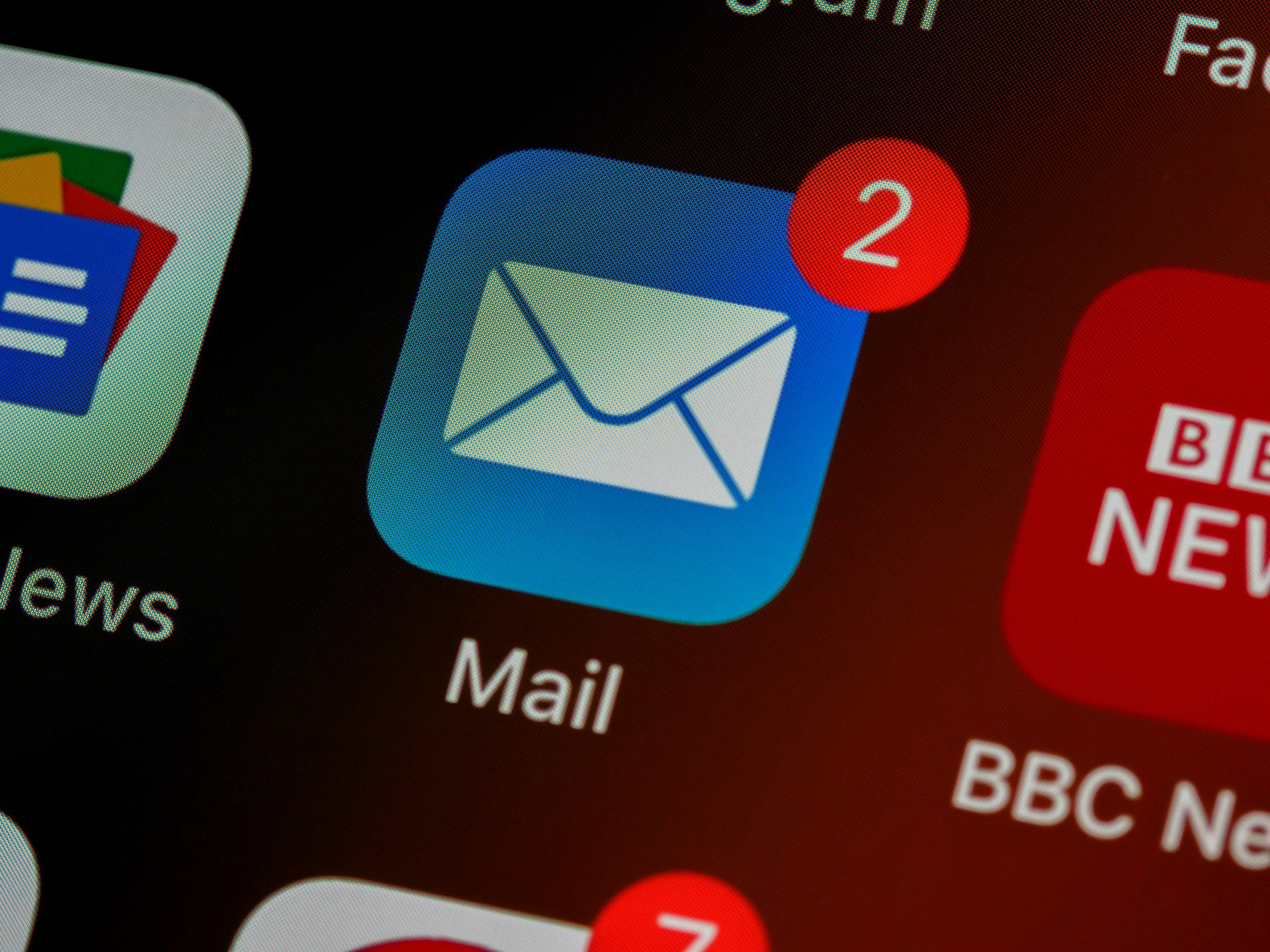 Email notification badge on mobile device screen showing unread messages