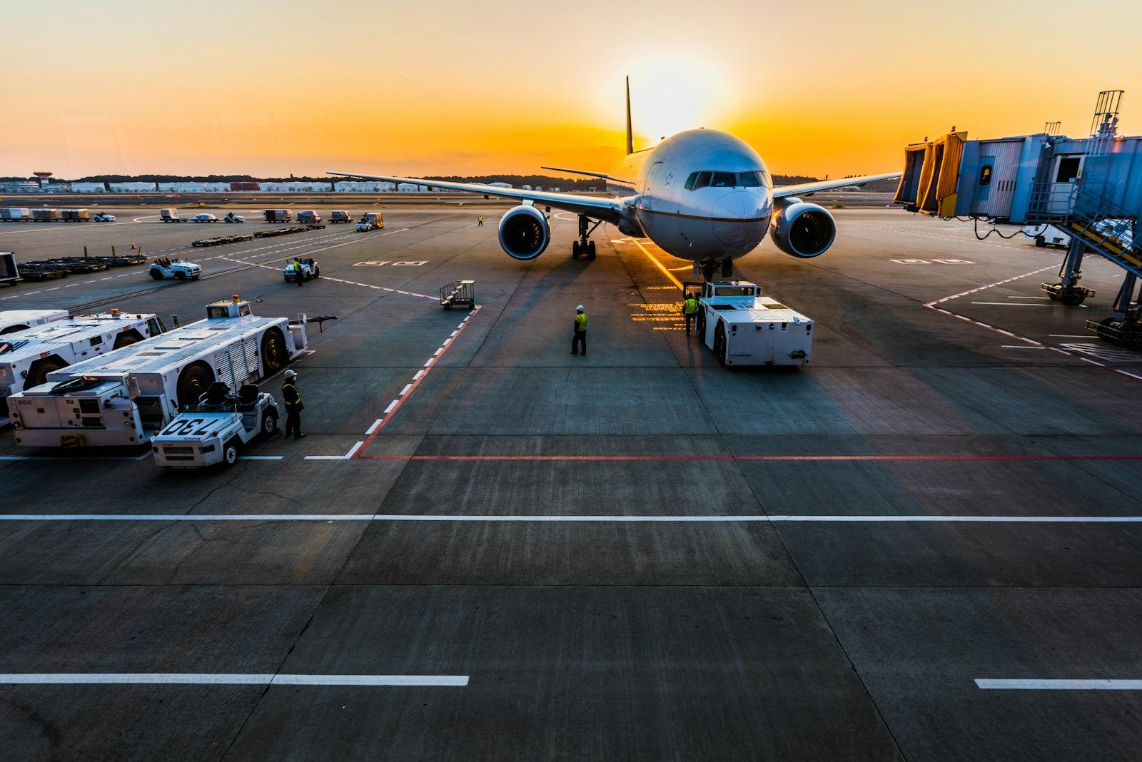 Freight containers being loaded at an airport cargo terminal